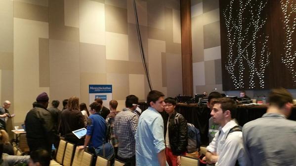 Developers wait in line to pitch their hack to Blockchain.