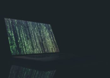 code falling on laptop screen featured image for XRP article
