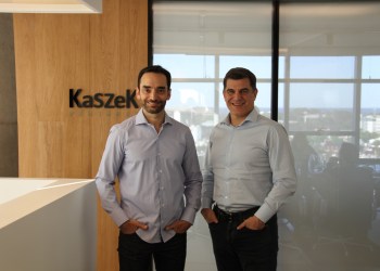 Kaszek founders standing in front of logo