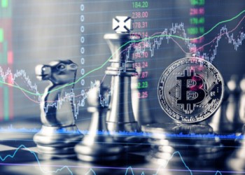 Picture of a silver Bitcoin crypto on a chess board, with red and green trend lines superimposed on it