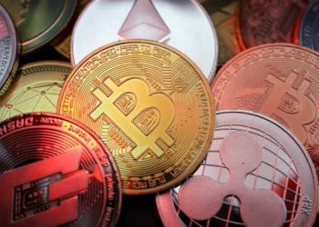 Picture of various crypto coins laying atop one another