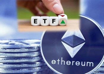 Picture of an Ethereum coin with ETF being held above it by a hand