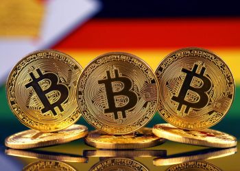 Picture of bitcoins in front of Zimbabwe flag