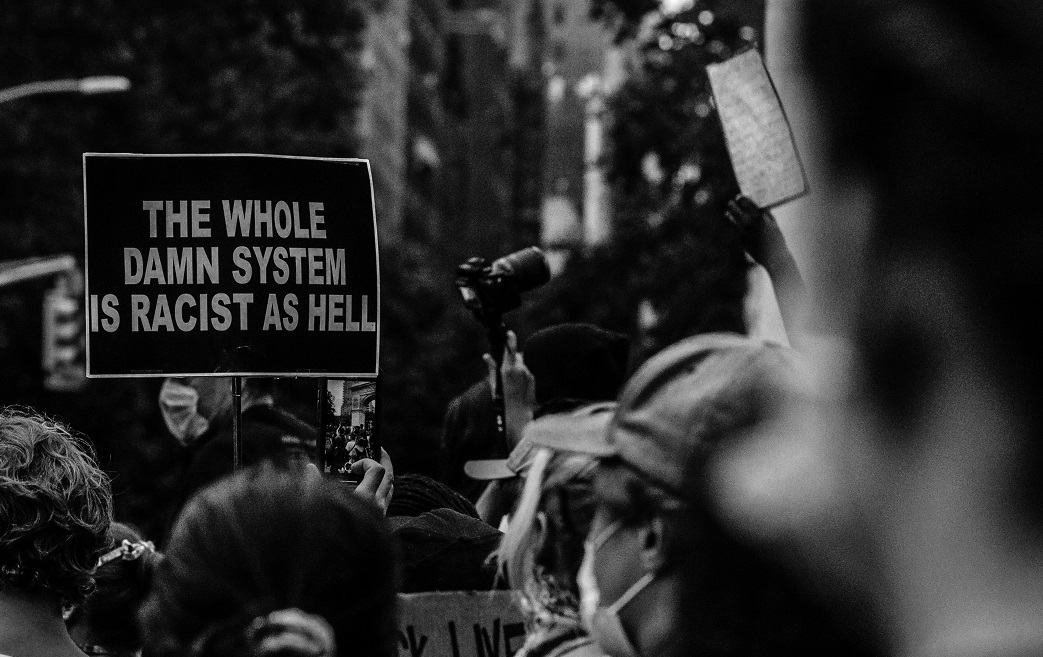 Bored Ape Yacht Club, a sign in a protest