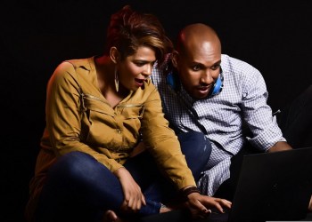 Binance Smart Chain, a couple reacts to a laptop